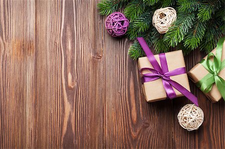 simsearch:400-04241664,k - Christmas gift boxes and fir tree on wooden table. Top view with copy space Stock Photo - Budget Royalty-Free & Subscription, Code: 400-08299742