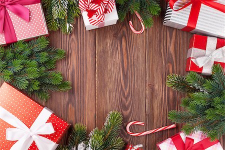simsearch:400-04241664,k - Christmas gift boxes and fir tree branch on wooden table. Top view with copy space Stock Photo - Budget Royalty-Free & Subscription, Code: 400-08299761
