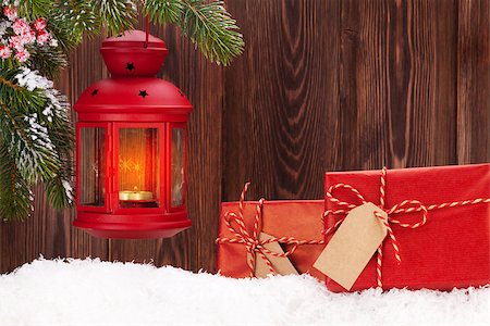 Christmas candle lantern and gift boxes in snow. View with copy space Stock Photo - Budget Royalty-Free & Subscription, Code: 400-08299774