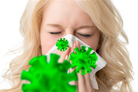 Portrait of a ill blond woman who is sneezing virus in a tissue Stock Photo - Budget Royalty-Free & Subscription, Code: 400-08299827