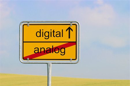 Yellow town sign with text "digital analog" Stock Photo - Budget Royalty-Free & Subscription, Code: 400-08290289