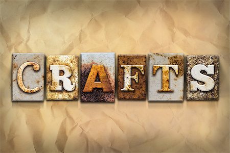 The word "CRAFTS" written in rusty metal letterpress type on a crumbled aged paper background. Stock Photo - Budget Royalty-Free & Subscription, Code: 400-08290802