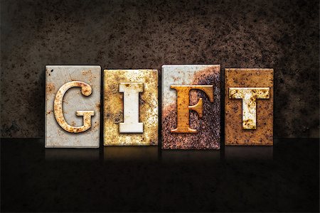 simsearch:400-08161047,k - The word "GIFT" written in rusty metal letterpress type on a dark textured grunge background. Stock Photo - Budget Royalty-Free & Subscription, Code: 400-08290815