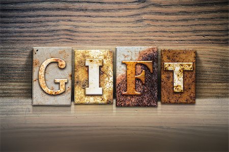 simsearch:400-08161047,k - The word "GIFT" written in rusty metal letterpress type sitting on a wooden ledge background. Stock Photo - Budget Royalty-Free & Subscription, Code: 400-08290817