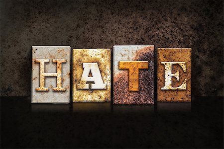 racist - The word "HATE" written in rusty metal letterpress type on a dark textured grunge background. Stock Photo - Budget Royalty-Free & Subscription, Code: 400-08290831