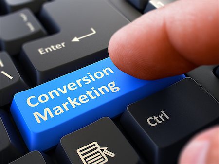 Computer User Presses Blue Button Conversion Marketing on Black Keyboard. Closeup View. Blurred Background. Stock Photo - Budget Royalty-Free & Subscription, Code: 400-08291087