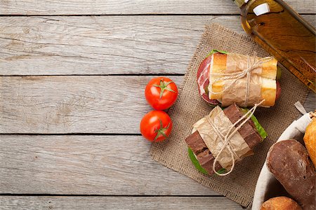 simsearch:400-07937807,k - Two sandwiches and white wine on wooden table. Top view with copy space Photographie de stock - Aubaine LD & Abonnement, Code: 400-08291189