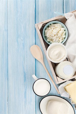 simsearch:400-08296754,k - Dairy products on wooden table. Sour cream, milk, cheese, yogurt and butter. Top view with copy space Stock Photo - Budget Royalty-Free & Subscription, Code: 400-08291209