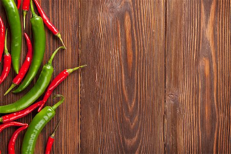 empty green color background - Chili peppers on wooden table with copy space Stock Photo - Budget Royalty-Free & Subscription, Code: 400-08291230