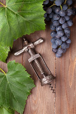 simsearch:400-08110621,k - Red grape and vintage corkscrew on wooden table Stock Photo - Budget Royalty-Free & Subscription, Code: 400-08291339