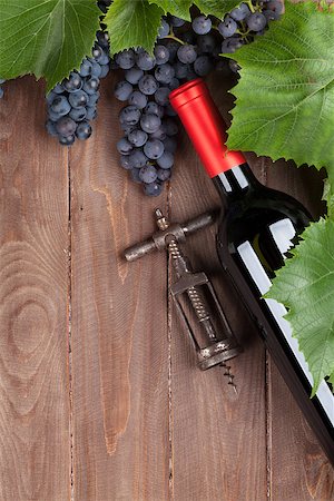 Red grape, wine bottle and vintage corkscrew on wooden table. Top view with copy space Stock Photo - Budget Royalty-Free & Subscription, Code: 400-08291340