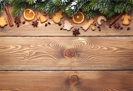 simsearch:400-07299371,k - Christmas wooden background with snow fir tree, spices, gingerbread cookies and copy space Foto de stock - Super Valor sin royalties y Suscripción, Código: 400-08291351