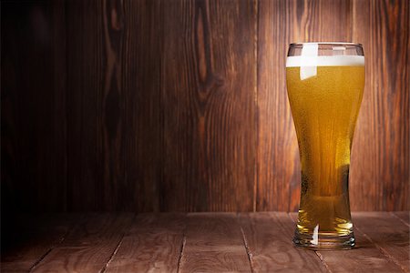 Lager beer glass on wooden table. View with copy space Stock Photo - Budget Royalty-Free & Subscription, Code: 400-08291386