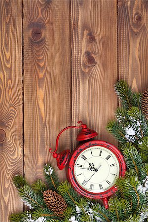 Christmas wooden background with clock, snow fir tree and copy space Stock Photo - Budget Royalty-Free & Subscription, Code: 400-08291425
