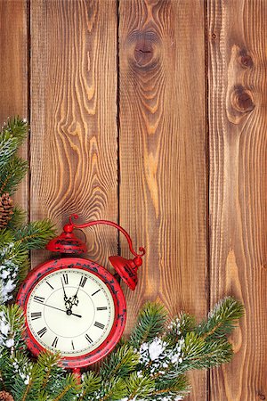 Christmas wooden background with clock, snow fir tree and copy space Stock Photo - Budget Royalty-Free & Subscription, Code: 400-08291426