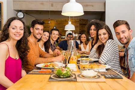 simsearch:400-08287050,k - Multi-Ethnic Group of happy friends lunching and having fun at the restaurant Stock Photo - Budget Royalty-Free & Subscription, Code: 400-08292245