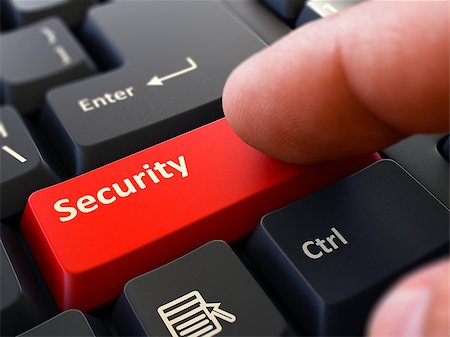 Finger Presses Red Button  Security on Black Keyboard Background. Closeup View. Selective Focus. Stock Photo - Budget Royalty-Free & Subscription, Code: 400-08292365