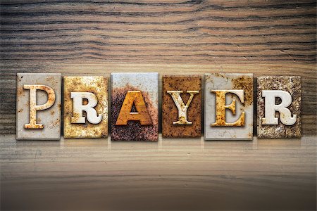 The word "PRAYER" written in rusty metal letterpress type sitting on a wooden ledge background. Stock Photo - Budget Royalty-Free & Subscription, Code: 400-08293197