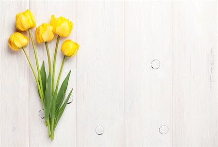 simsearch:400-08036453,k - Yellow tulips over wooden table background with copy space Stock Photo - Budget Royalty-Free & Subscription, Code: 400-08293267