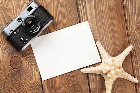 simsearch:400-08289506,k - Travel and vacation photo frame, starfish and camera on wooden table Photographie de stock - Aubaine LD & Abonnement, Code: 400-08293292