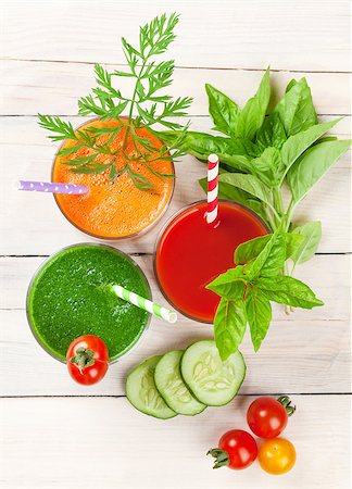 simsearch:400-07172598,k - Fresh vegetable smoothie on wooden table. Tomato, cucumber, carrot. Top view Stock Photo - Budget Royalty-Free & Subscription, Code: 400-08293302