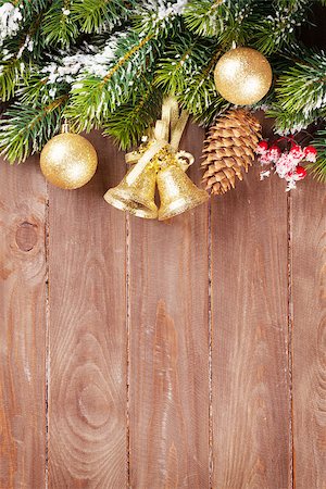 simsearch:400-07179654,k - Christmas tree branch with decor on wooden background with copy space Photographie de stock - Aubaine LD & Abonnement, Code: 400-08293365