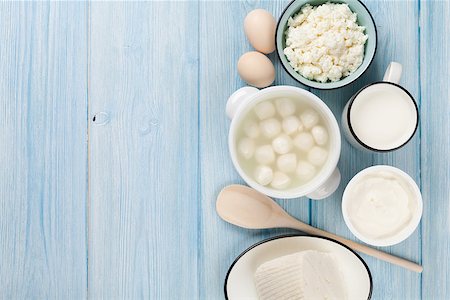 simsearch:400-08296754,k - Dairy products on wooden table. Sour cream, milk, cheese, eggs and yogurt. Top view with copy space Stock Photo - Budget Royalty-Free & Subscription, Code: 400-08293418