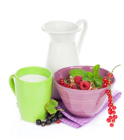 porridge and berries - Healthy breakfast with muesli and milk. Isolated on white background Stock Photo - Budget Royalty-Free & Subscription, Code: 400-08293426