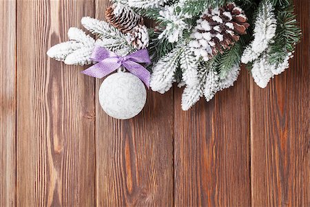 simsearch:400-07179654,k - Christmas wooden background with snow firtree and bauble. View with copy space Photographie de stock - Aubaine LD & Abonnement, Code: 400-08293490