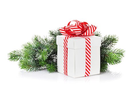 simsearch:400-07933751,k - Christmas gift box and fir tree branch. Isolated on white background Photographie de stock - Aubaine LD & Abonnement, Code: 400-08300788