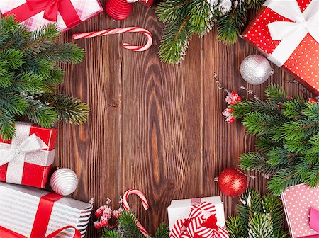 simsearch:400-04241664,k - Christmas gift boxes, decor and fir tree branch on wooden table. Top view with copy space Stock Photo - Budget Royalty-Free & Subscription, Code: 400-08301767