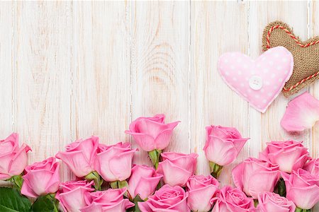 simsearch:400-08110734,k - Valentines day card with pink roses and handmaded toy hearts over wooden table. Top view with copy space Stock Photo - Budget Royalty-Free & Subscription, Code: 400-08301816