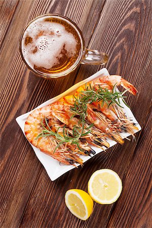 penaeus monodon - Beer mug and grilled shrimps on wooden table. Top view Stock Photo - Budget Royalty-Free & Subscription, Code: 400-08301859
