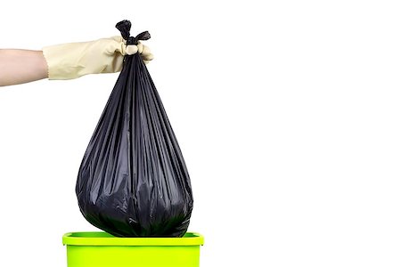 One hand with a glove, holding a garbage bag on a green bin. Stock Photo - Budget Royalty-Free & Subscription, Code: 400-08314412