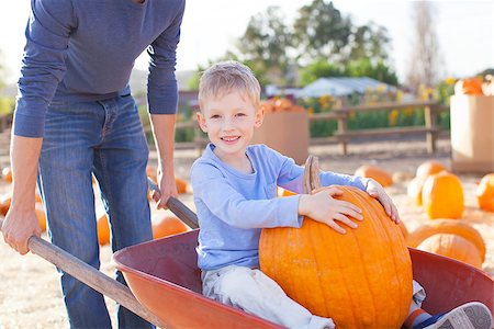 simsearch:400-07916492,k - smiling little boy having fun at pumpkin patch, sitting in the cart with huge pumpkin enjoying time with father, american tradition Stock Photo - Budget Royalty-Free & Subscription, Code: 400-08314430