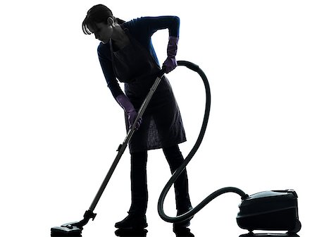 one  woman maid Vacuum Cleaner cleaning in silhouette studio isolated on white background Stock Photo - Budget Royalty-Free & Subscription, Code: 400-08314748