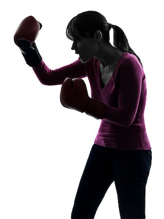 one  woman with boxing gloves in silhouette studio isolated on white background Stock Photo - Budget Royalty-Free & Subscription, Code: 400-08314795