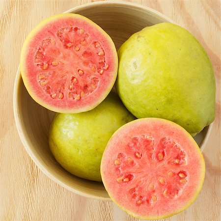 Fresh goiaba on wooden table. Selective focus. tonning effect Stock Photo - Budget Royalty-Free & Subscription, Code: 400-08315241