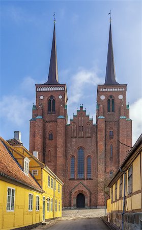 Roskilde Cathedral is a cathedral of the Lutheran Church of Denmark.  The first Gothic cathedral to be built of brick, it encouraged the spread of the Brick Gothic style throughout Northern Europe. Stockbilder - Microstock & Abonnement, Bildnummer: 400-08315253