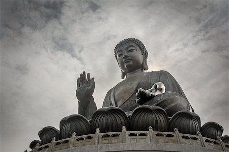 Tian Tan Buddha or the Big Buddha is a large bronze statue of a Buddha Amoghasiddhi in Hong Kong. Hong Kong is popular tourist destination of Asia. Stock Photo - Budget Royalty-Free & Subscription, Code: 400-08315347