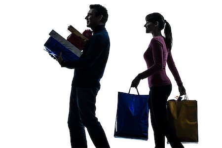 one  couple woman man christmas present shopping in silhouette studio isolated on white background Stock Photo - Budget Royalty-Free & Subscription, Code: 400-08315453
