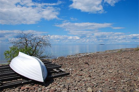 Coastal view with a white boat up side down on the ground. From the swedish island oland in the Baltic Sea Foto de stock - Super Valor sin royalties y Suscripción, Código: 400-08315516