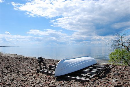 Coastline with a white boat up side down at the swedish island oland in the Baltic Sea Foto de stock - Super Valor sin royalties y Suscripción, Código: 400-08315517