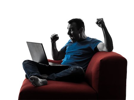 simsearch:400-08317008,k - one caucasian man sofa couch computer computing laptop in silhouette isolated on white background Stockbilder - Microstock & Abonnement, Bildnummer: 400-08315557