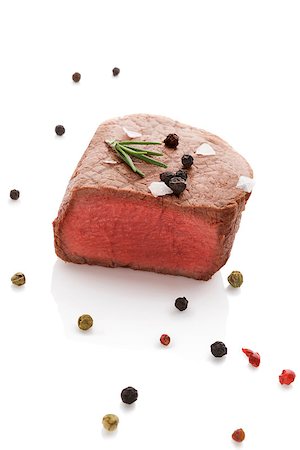 filet mignon - Beefsteak with rosemary and colorful peppercorn isolated on white background. Culinary red meat eating. Stockbilder - Microstock & Abonnement, Bildnummer: 400-08316211