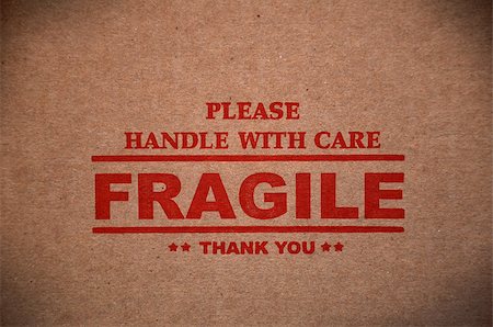 Fragile warning sign label tag on a cardboard box packet parcel Stock Photo - Budget Royalty-Free & Subscription, Code: 400-08316225