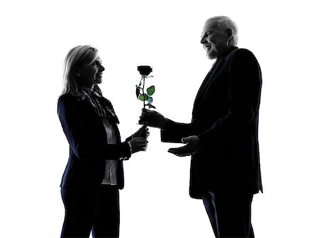 one caucasian couple senior lovers flower rose silhouette  in silhouette studio isolated on white background Stock Photo - Budget Royalty-Free & Subscription, Code: 400-08316675