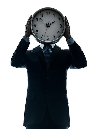 one  businessman holding clock in silhouette studio isolated on white background Stock Photo - Budget Royalty-Free & Subscription, Code: 400-08316833