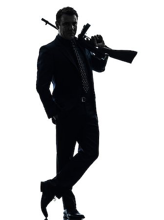 one  man holding thompson machine gun in silhouette on white background Stock Photo - Budget Royalty-Free & Subscription, Code: 400-08316845