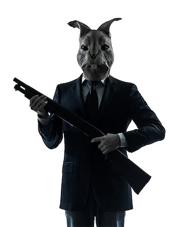 one  man rabbit mask hunting with shotgun portrait in silhouette studio isolated on white background Stock Photo - Budget Royalty-Free & Subscription, Code: 400-08316880